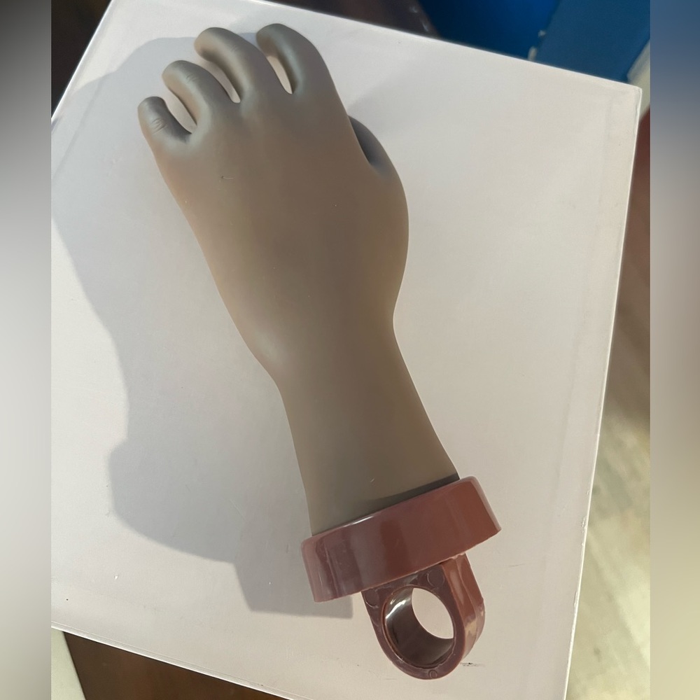 Silicone nail practice hand Flexible and easy to use Left hand. 
Brown Mannequin
